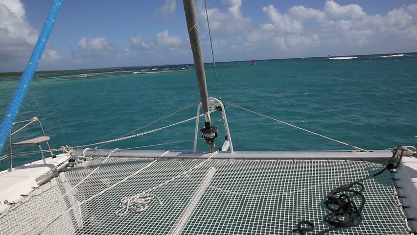 Catamaran sailing in caribbean water