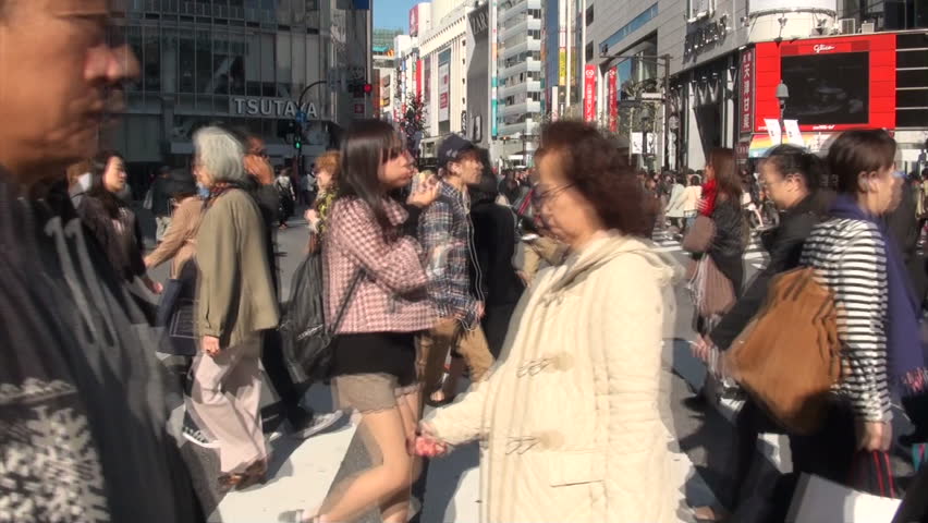 TOKYO, JAPAN - 4 NOVEMBER 2012: 'Abbey Road view' of people walking on the famous Shibuya crossing in downtown Tokyo