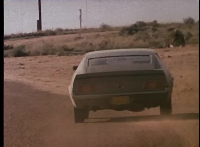 Car pulling u-turn off road
