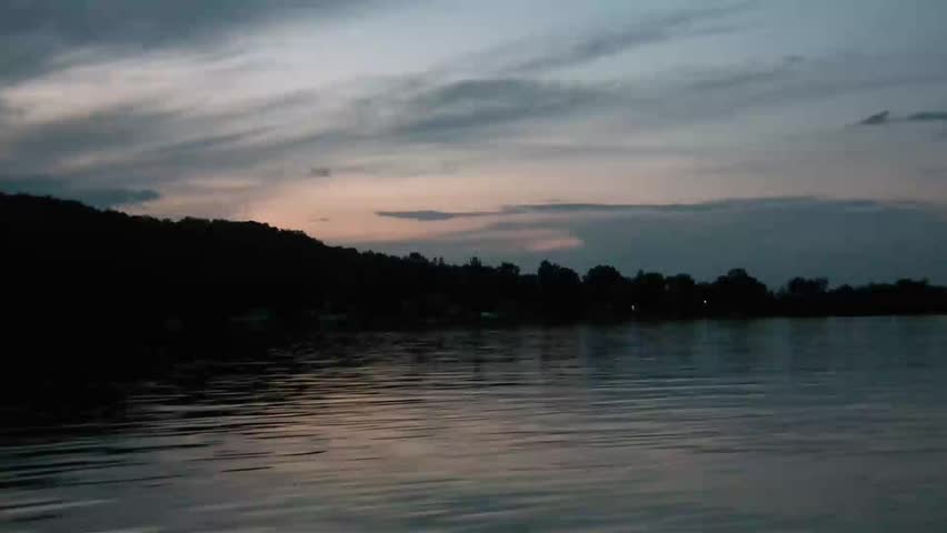 Clip of a pristine lake in Minnesota at dusk yielding visually appealing view.