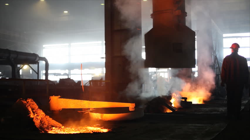 Hard work in the Foundry, liquid metal in the factory, smelting iron and processing