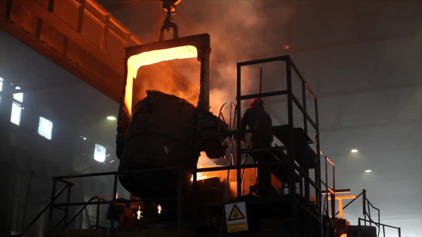 Hard work in the Foundry, liquid metal in the factory, smelting iron and processing
