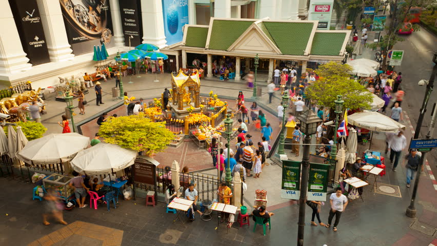 BANGKOK - 04 DEC: Timelapse view of people at an inner city Shrine in the Siam area of Bangkok on 4 December 2011 in Bangkok, Thailand