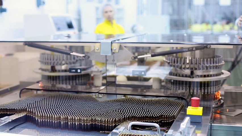 Automatic optical inspection machine, inspects vials and ampoules for particulates in liquid and container defects.