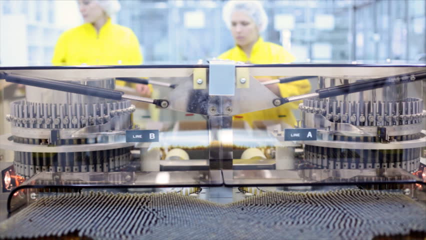 Automatic optical inspection machine, inspects vials and ampoules for particulates in liquid and container defects.