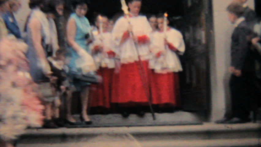JOHNSTOWN, NEW YORK - JUNE 28, 1964 - 8mm film footage of a group of Catholic school kids leave the church after graduation in 1964.