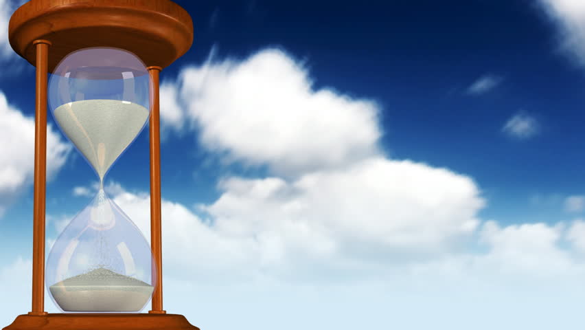 Seamlessly looping animation of a sand hourglass with clouds in the background.