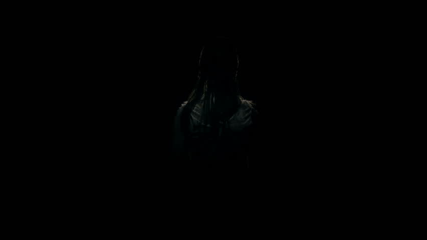 creepy undead girl spins and stares into camera