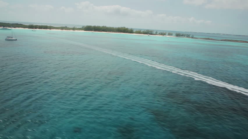 Aerial of speedboat cutting through the ocean