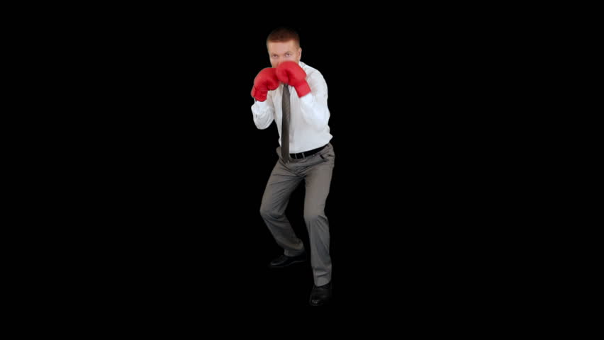Businessman Boxing, full length against black