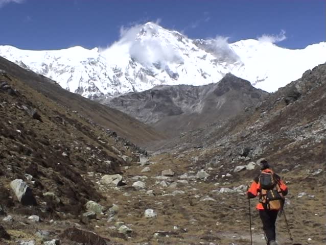 Trekkers below Cho Oyu Mountain, Everest region, Nepal