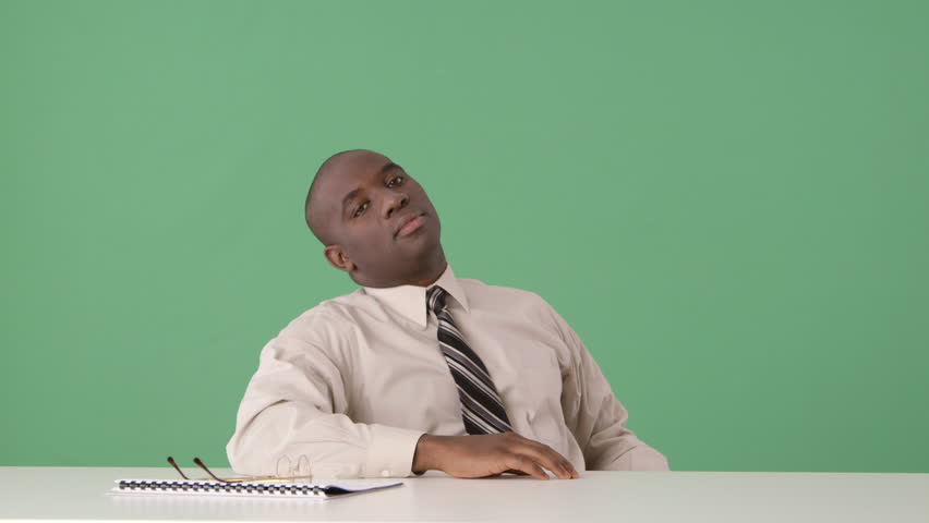 African American businessman bored at desk