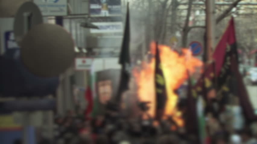 Protesters in Eastern Europe start a fire.