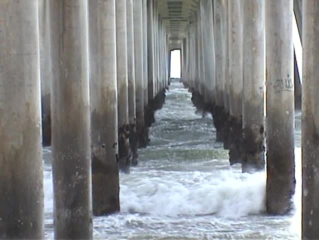 beneath the world famous Huntington Beach pier during heavy winds and rough seas With Sound