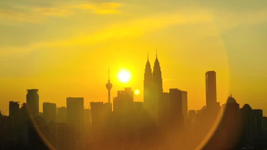 Time lapse of sun setting over skyline during sunset of Kuala Lumpur, Malaysia