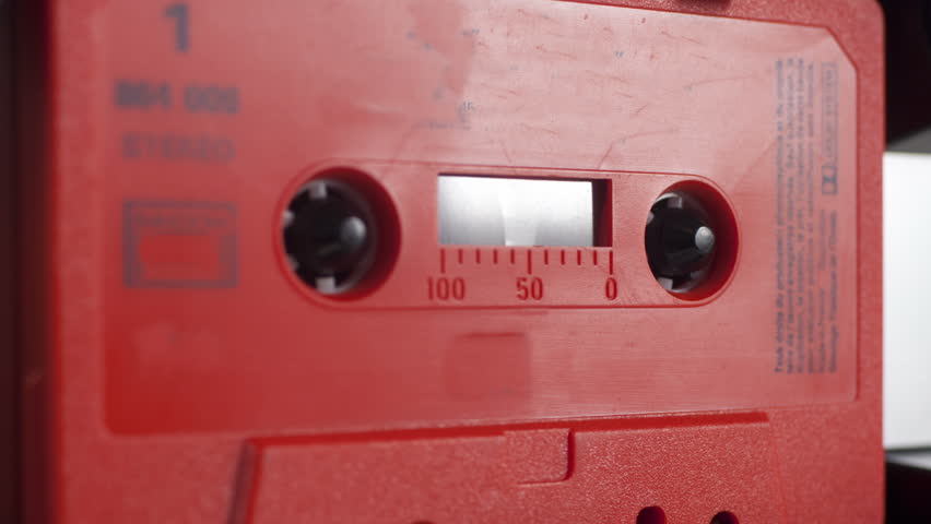 sequence of old audio cassettes in a retro tape player
