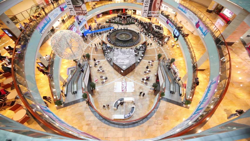 MOSCOW - SEP 7: People up and down the escalators in AFIMALL City on September 7, 2011 in Moscow, Russia. AFIMALL CITY located in the core of Moscow City.