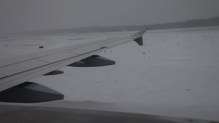 video footage of a airplane in the airstrip in winter, germany