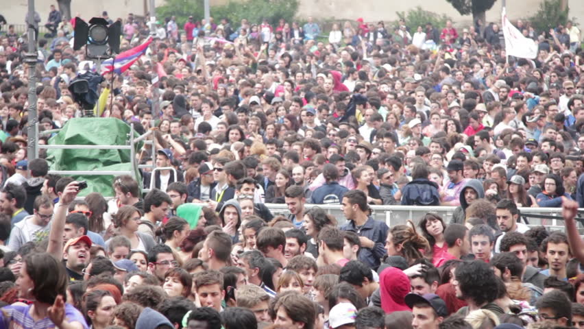 ROME, ITALY - MAY 1: People attend free "Concerto del Primo Maggio" ("Workers' Day Concert") in Piazza San Giovanni (San Giovanni Square) on Workers' Day, May 1, 2012 in Rome, Italy.