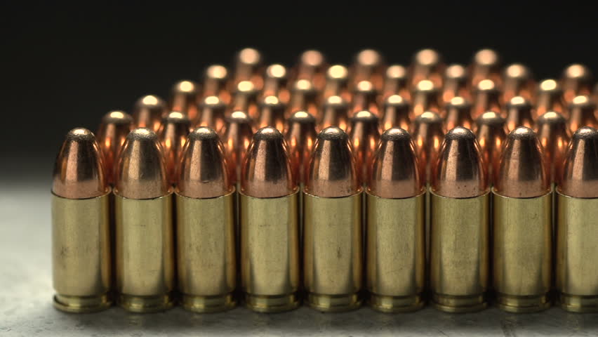 Macro shot of 9 mm handgun Bullets. Dollies to the right