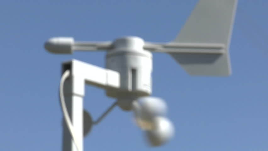weathervane instruments and barbed wire fence