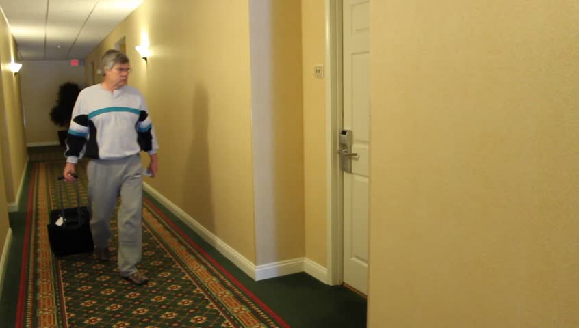 guest enters a motel room with a key-card