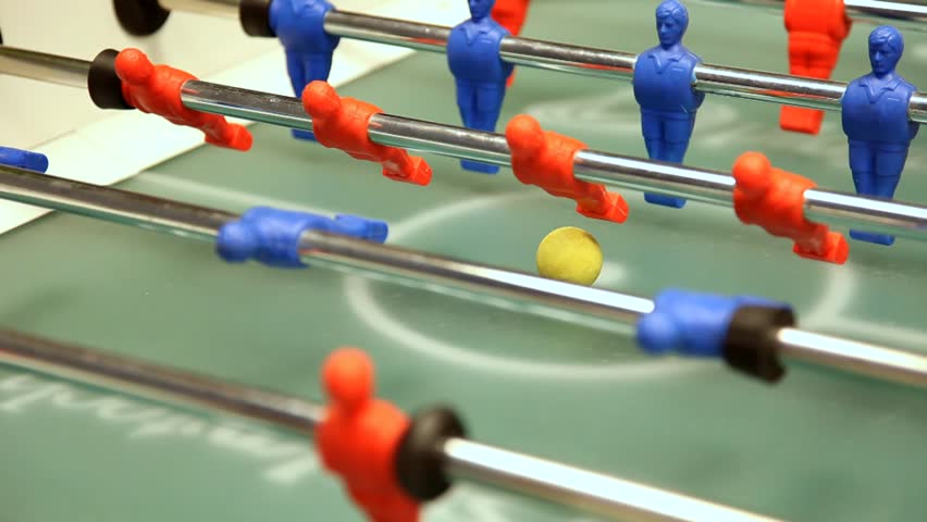 Kick off strike in table football game. 