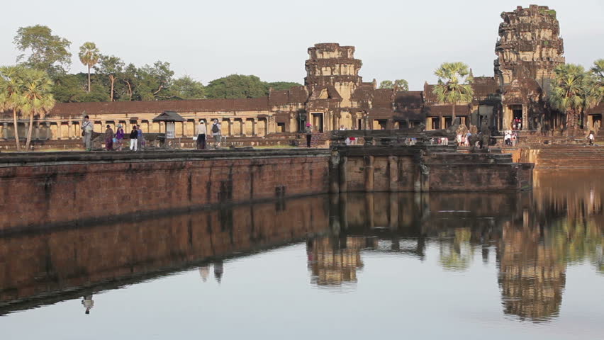 ANGKOR THOM - DECEMBER 4: Time lapse of tourist crowd crossing the bridge leading to Angkor Wat temple on December 4, 2012 in Angkor Thom antic city, near Siem Reap, Cambodia.