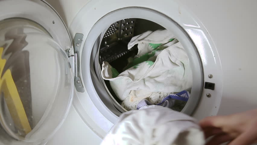 Throwing clothes to washing machine
