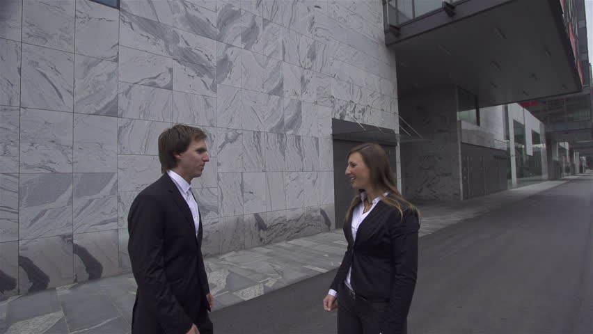 SLOW MOTION: Businessman and businesswoman fist bump