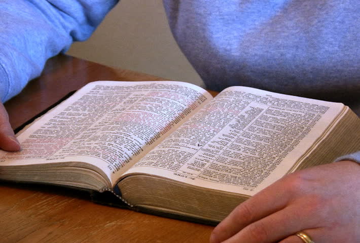Studying the Bible.