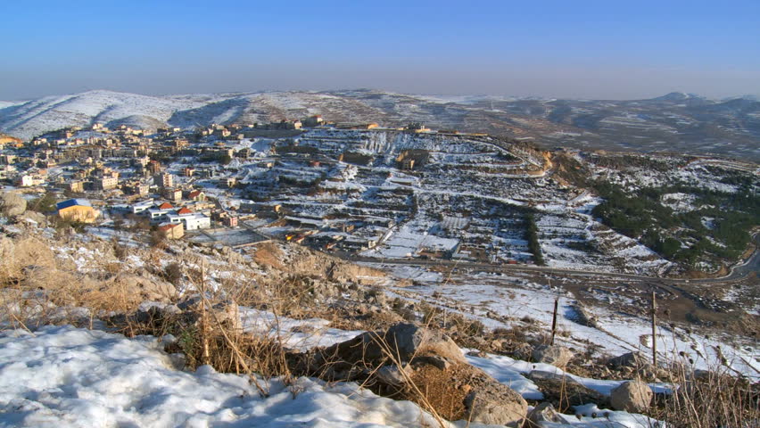 View towards snowy golan heights including Druse villages-Mas ade, Majdal shams, Ein Qiniyye and Lake Ram, Israel
