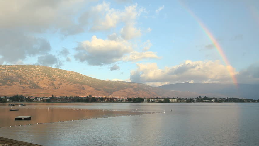 Rainbow, Osoyoos Lake, British Columbia. A rainbow curves over the hills surrounding Osoyoos Lake. Okanagan, British Columbia, Canada.