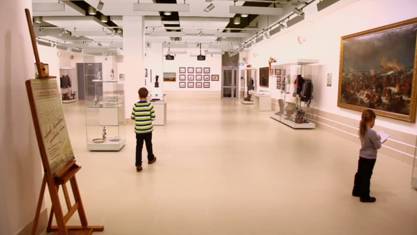 MOSCOW - DEC 10: Two kids boy and little girl walk by exposition of 1812 year at exhibition center - Worker and Collective Farm Girl on december 10, 2011 in Moscow, Russia.