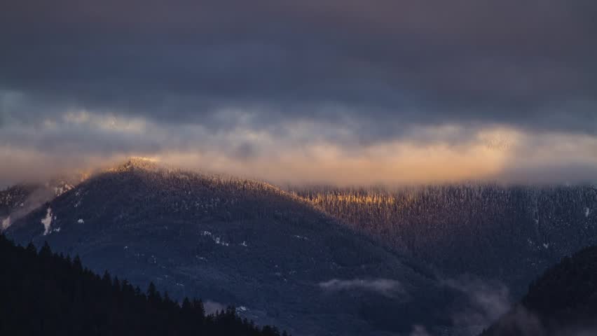 Morning Light on a Snow Mountain at Lillooet Lake, BC, Canada.  Photo Sequence shot in RAW and Post-Production in After Effects.