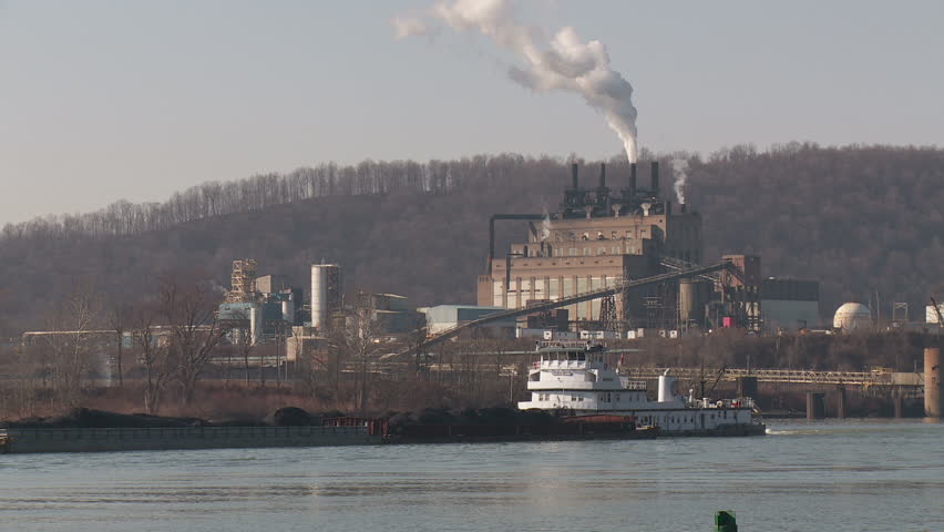 SHIPPINGPORT, PA - MARCH 31: Amherst Madison towboat (pushboat) Mary Ellen Jones pushes a barge past the Nova Chemicals plant on the Ohio River on March 31, 2013 near Shippingport, Pennsylvania. 