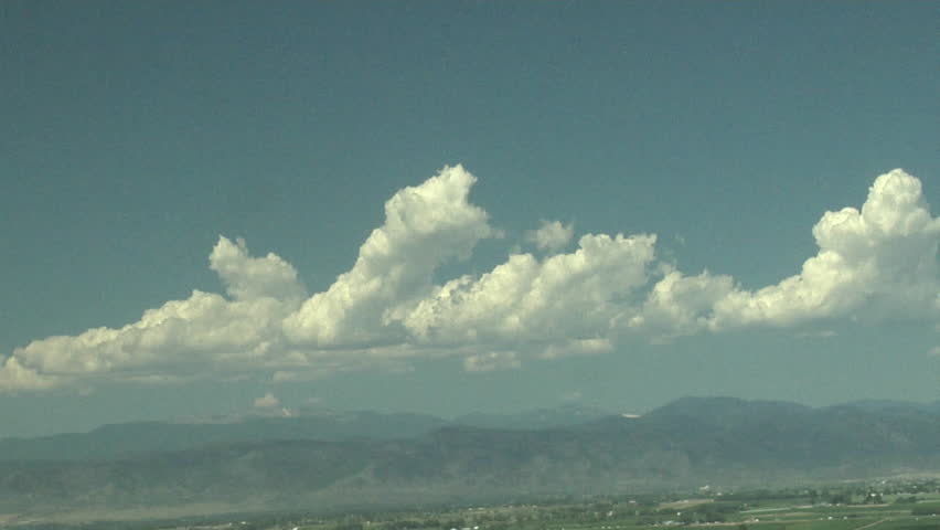 Mountain Cumulus. Boiling cumulus congestus clouds build up over heated mountain peaks on a summer day.