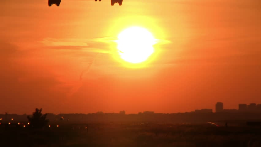 Jet landing at sunset