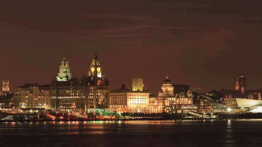 Time lapse of moonrise over Liverpool skyline at night