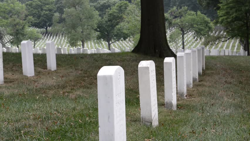 WASHINGTON DC - AUGUST 19: Gravestones on Arlington National Cemetery August 19, 2012 in Washington DC, USA. Veterans from each of the nation's wars are interred in the cemetery.