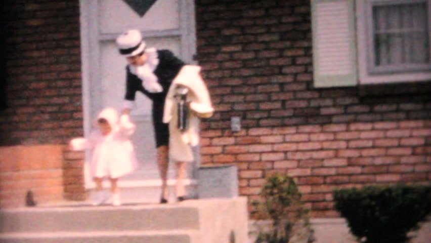 JOHNSTOWN, NEW YORK, 1964: A mother and daughter model their new Easter dresses in front of their home in 1964.
