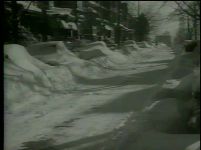 Cars are buried under snow after the snowstorm on the streets and on the highways from Midwest to the Eastern Seaboard circa 1964-MGM PICTURES, UNIVERSAL-INTERNATIONAL NEWSREEL, USA, filmed in 1964  