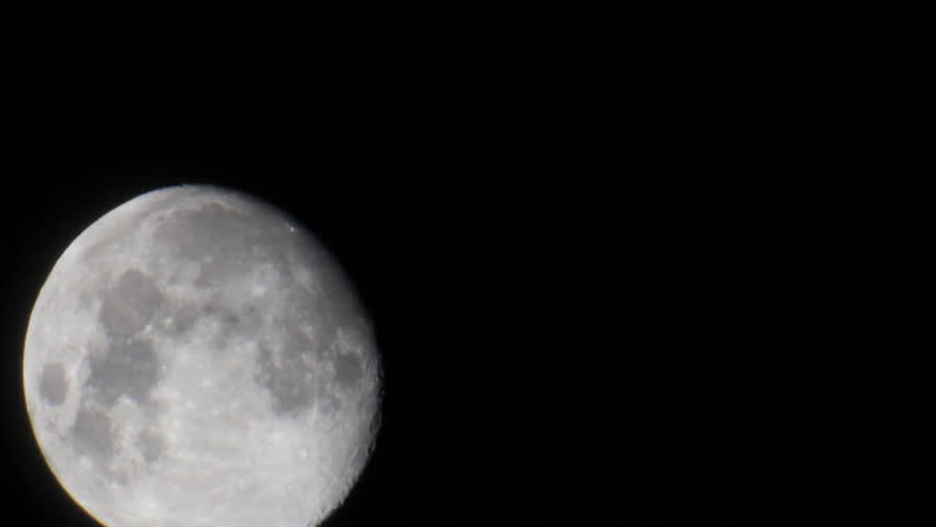 Almost full moon on the black space