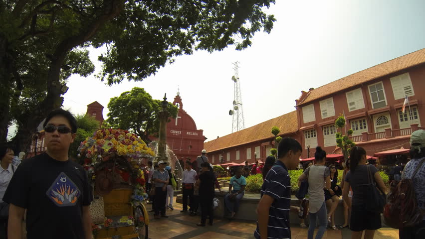MALACCA - MARCH 25: stop motion timelapse of tourists around the fountain in front of Church in Malacca Malaysia on 25th March 2013