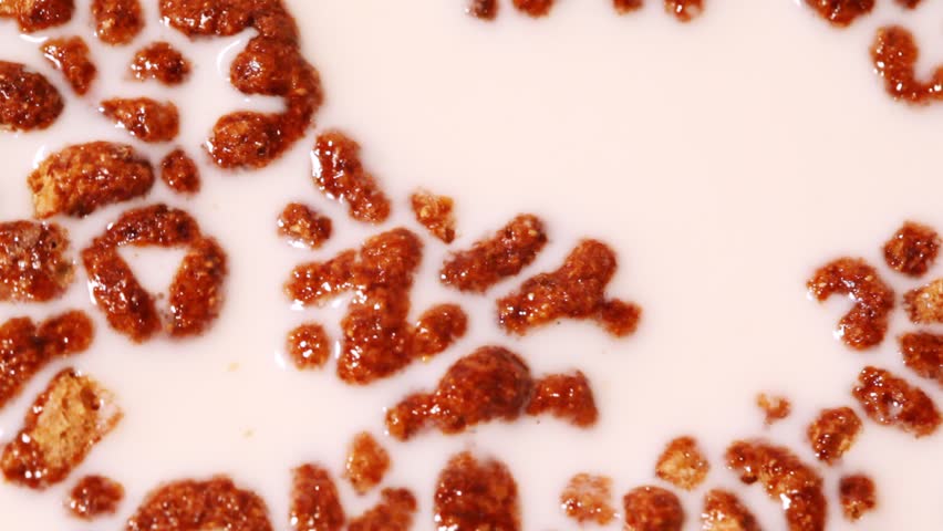 Cereals floating in milk, zoom in