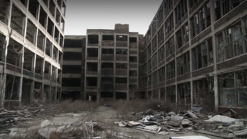 Developer (could be an architect, investor, contractor or other business person) walks into shot and looks around at the ruined buildings around him, making notes. Close up shot, hand held camera.