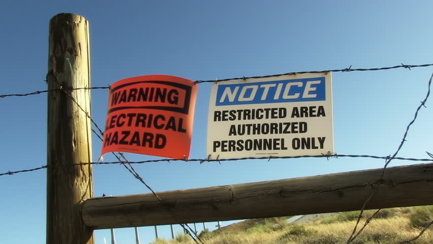 Warning and Restricted signs on Barbed Wire