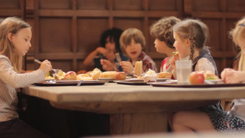 School food - a group of elementary school children eating a school lunch