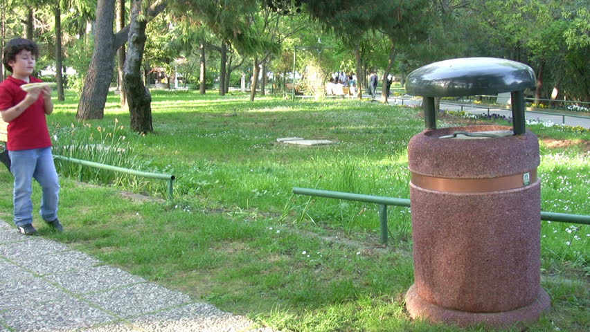 Little boy Picking Up Litter