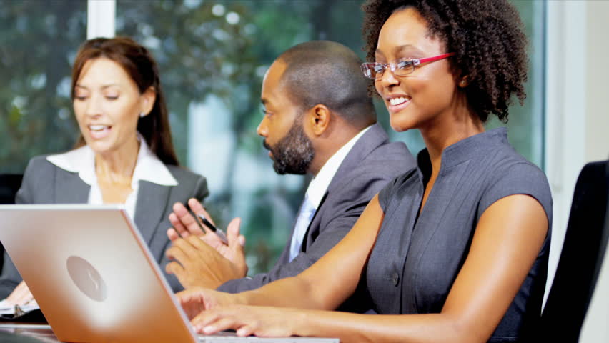 Successful female Caucasian business executive chairing boardroom meeting multi ethnic colleagues shot on RED EPIC